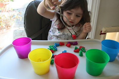 We used a pair of tongs to pick up the bears, which is also good for building up those hand muscles needed for writing. Toddler Tasks Week 6!