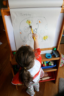 Since we released 1,500 ladybugs this week, we decided to paint a ladybug on the art easel. Toddler Tasks Week 6!