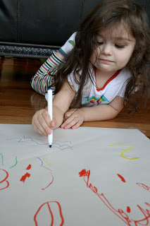 I taped a piece of paper to the floor and let her draw a picture. Toddler Tasks Week 6!