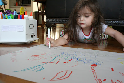 I taped a piece of paper to the floor and let her draw a picture. Toddler Tasks Week 6!