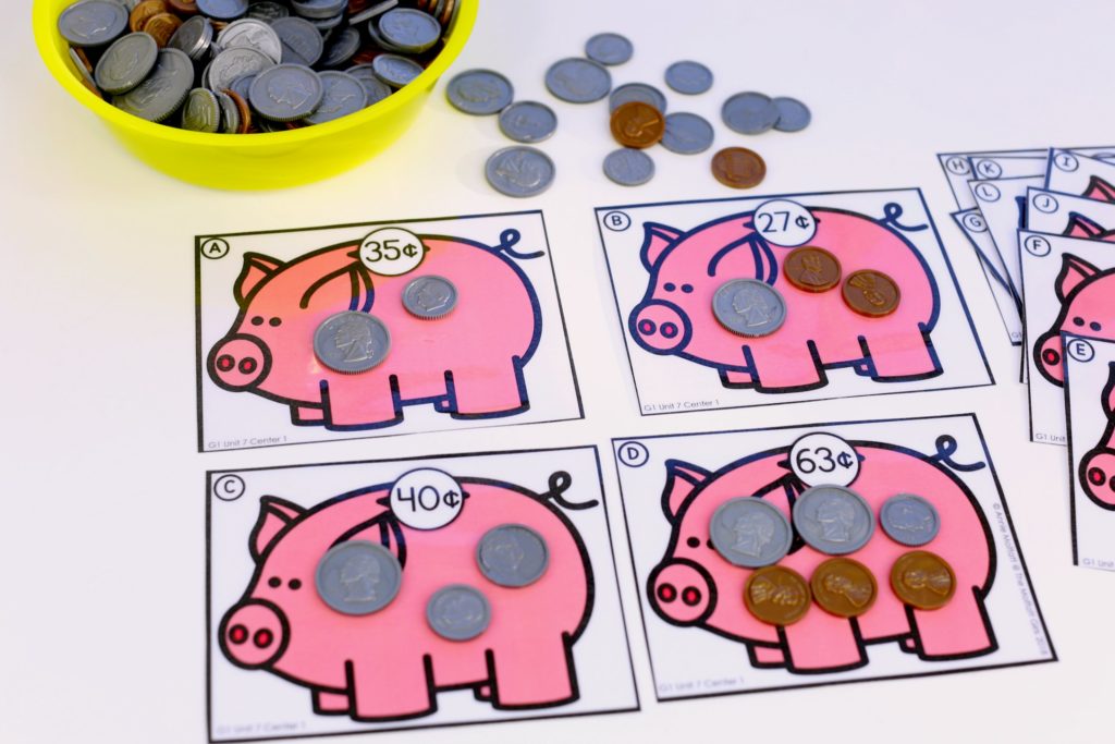 Piggy Bank Money Game for 1st Grade Money Games- Count up coins to match the value on the piggy bank. Such a fun math center for 1st graders!